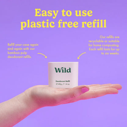 Wild plastic-free coconut and vanilla deodorant refill in a compostable bamboo pulp casing held in a hand.