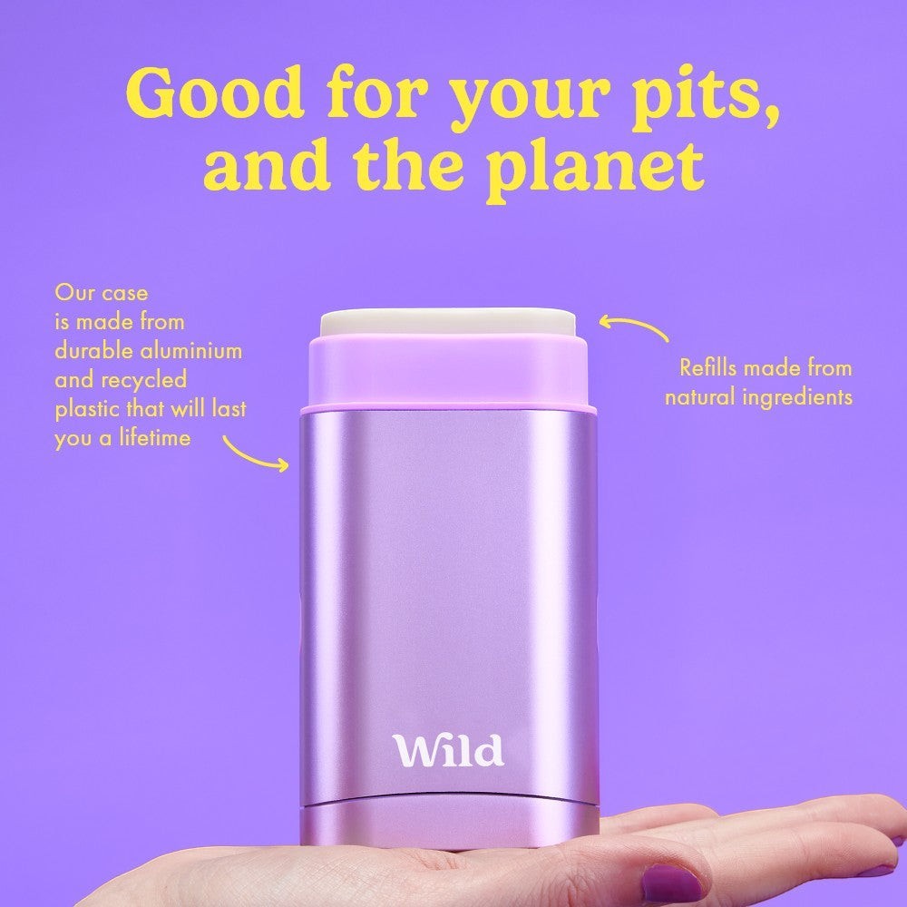 Wild refillable deodorant in a purple anodised aluminium case held in a hand against a purple background.